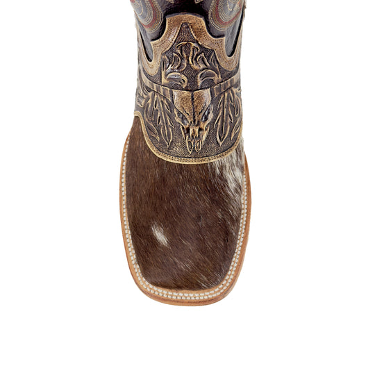 Boot shaft and upper vamp: carved bull-head design over brown-and-white cowhide