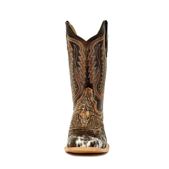 Men’s cowboy boots front view: pointed toe, hand-tooled design, black-and-white cowhide