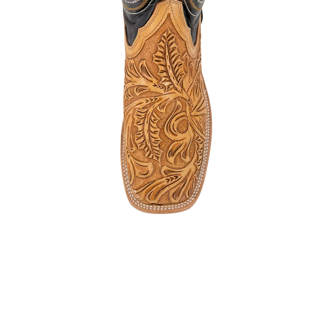 Tan boot shaft with floral hand-tooled carving and curved stitch borders