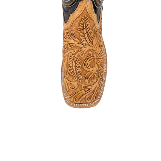 Tan boot shaft with floral hand-tooled carving and curved stitch borders