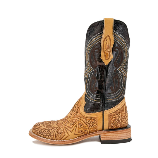 Western boot with tall dark shaft, tan carved toe and bulldog-style front emblem