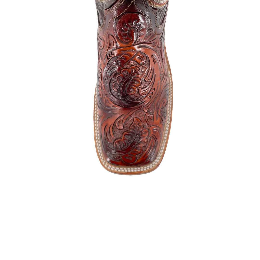 Cognac boot toe with deep embossed floral tooling and leather welt