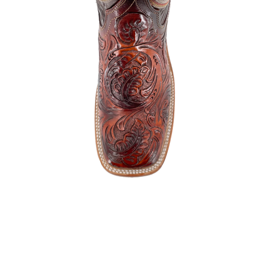 Cognac boot toe with deep embossed floral tooling and leather welt