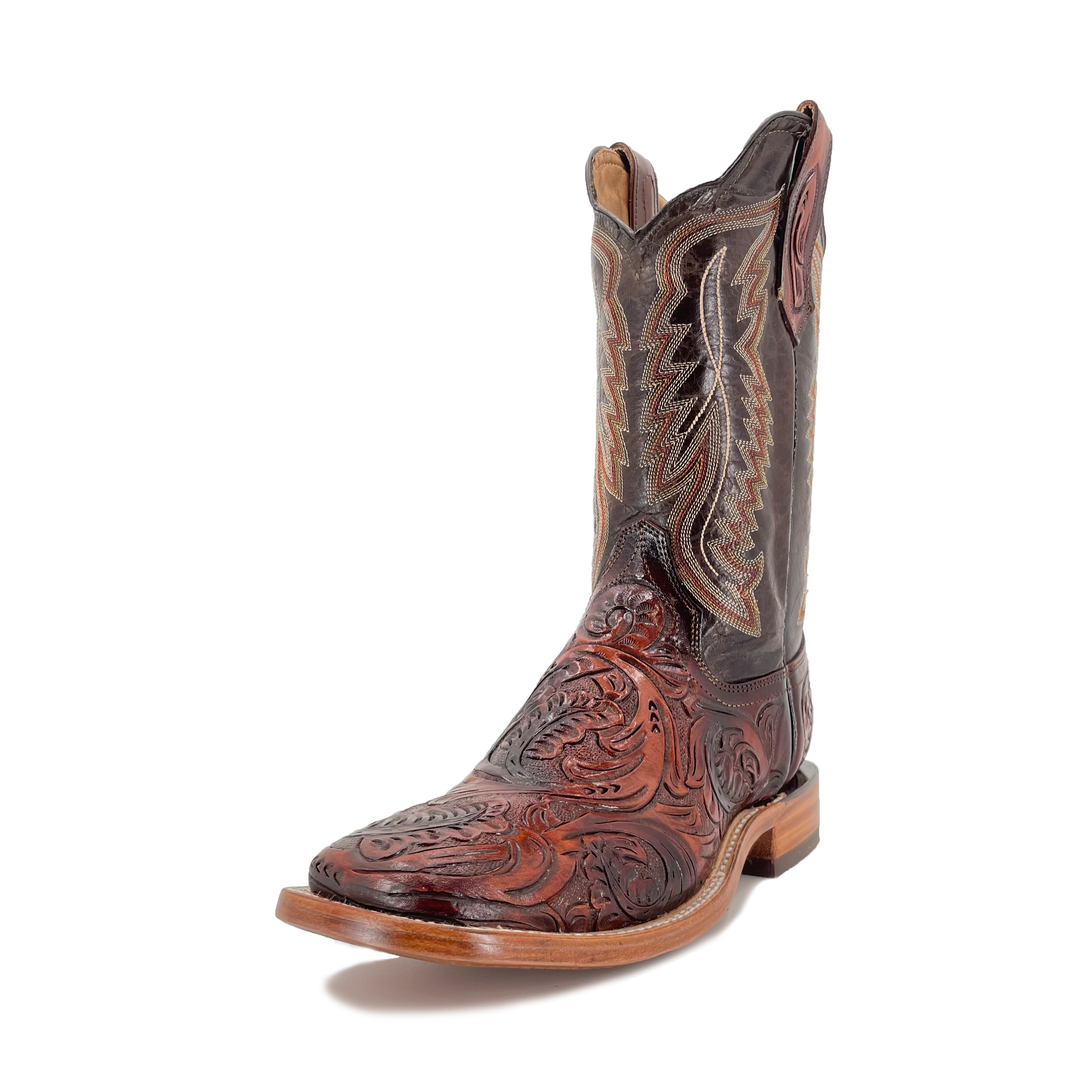 Cognac cowboy boot showing side profile, carved toe and decorative panel stitching