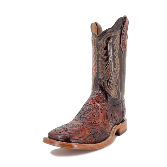 Cognac cowboy boot showing side profile, carved toe and decorative panel stitching