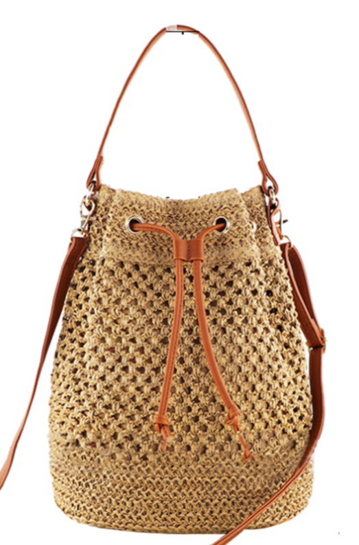 Khaki woven bucket bag with brown handle, front grommets and drawstring