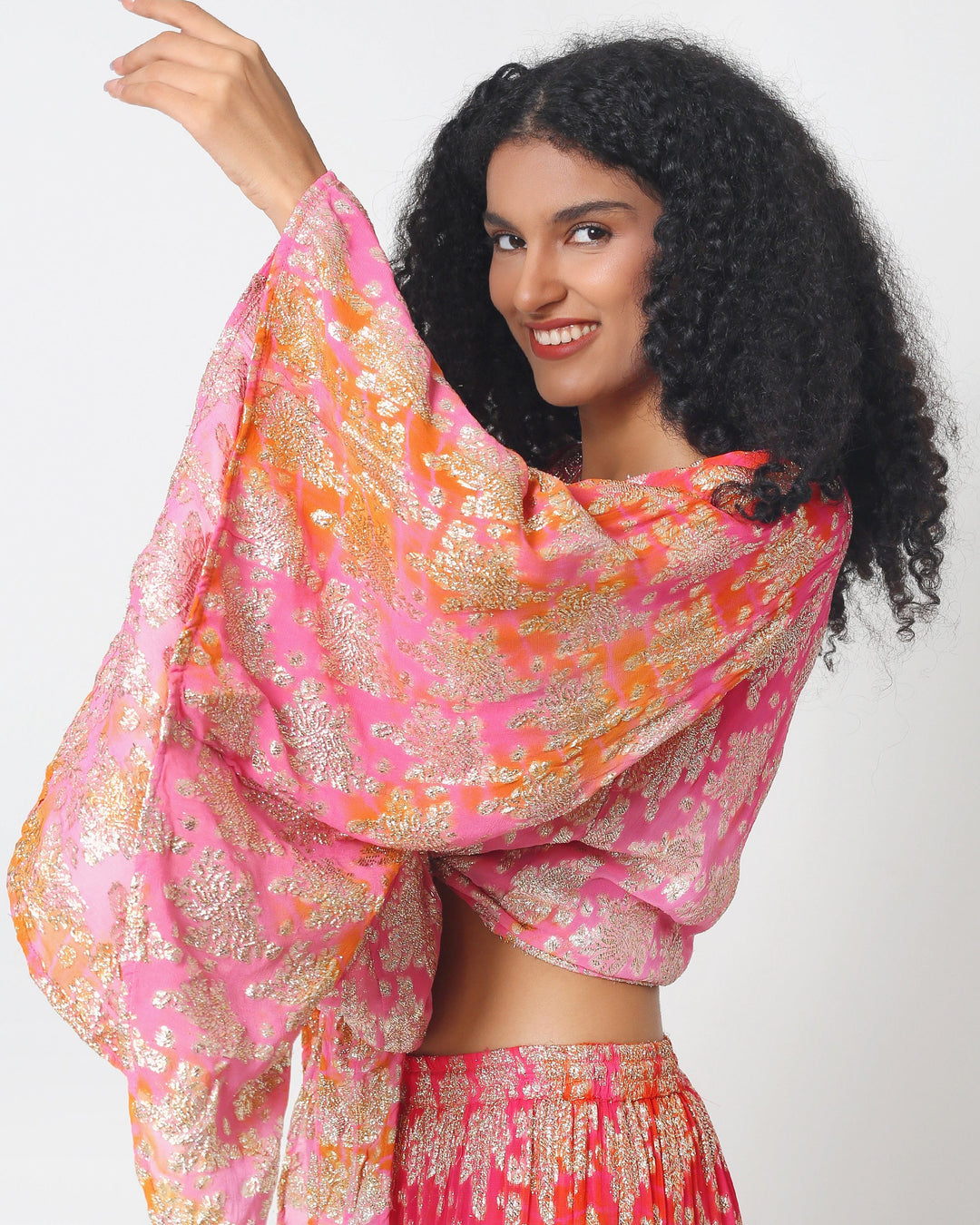 Bali skirt set detail: pink metallic floral wrap-style top with knotted waist