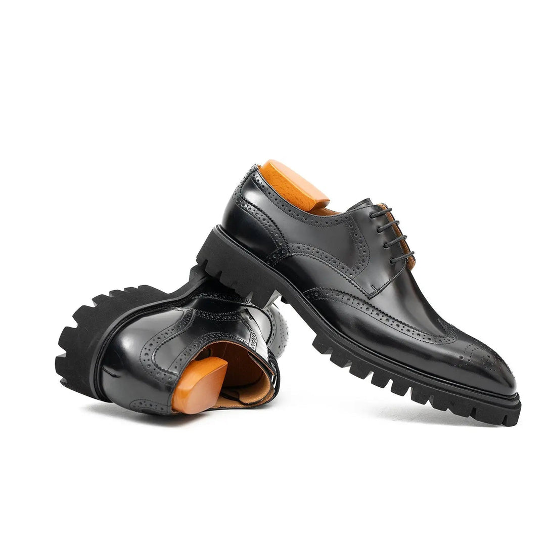 Black derby brogue shoes with lace-up vamp and perforated detailing, thick tread sole
