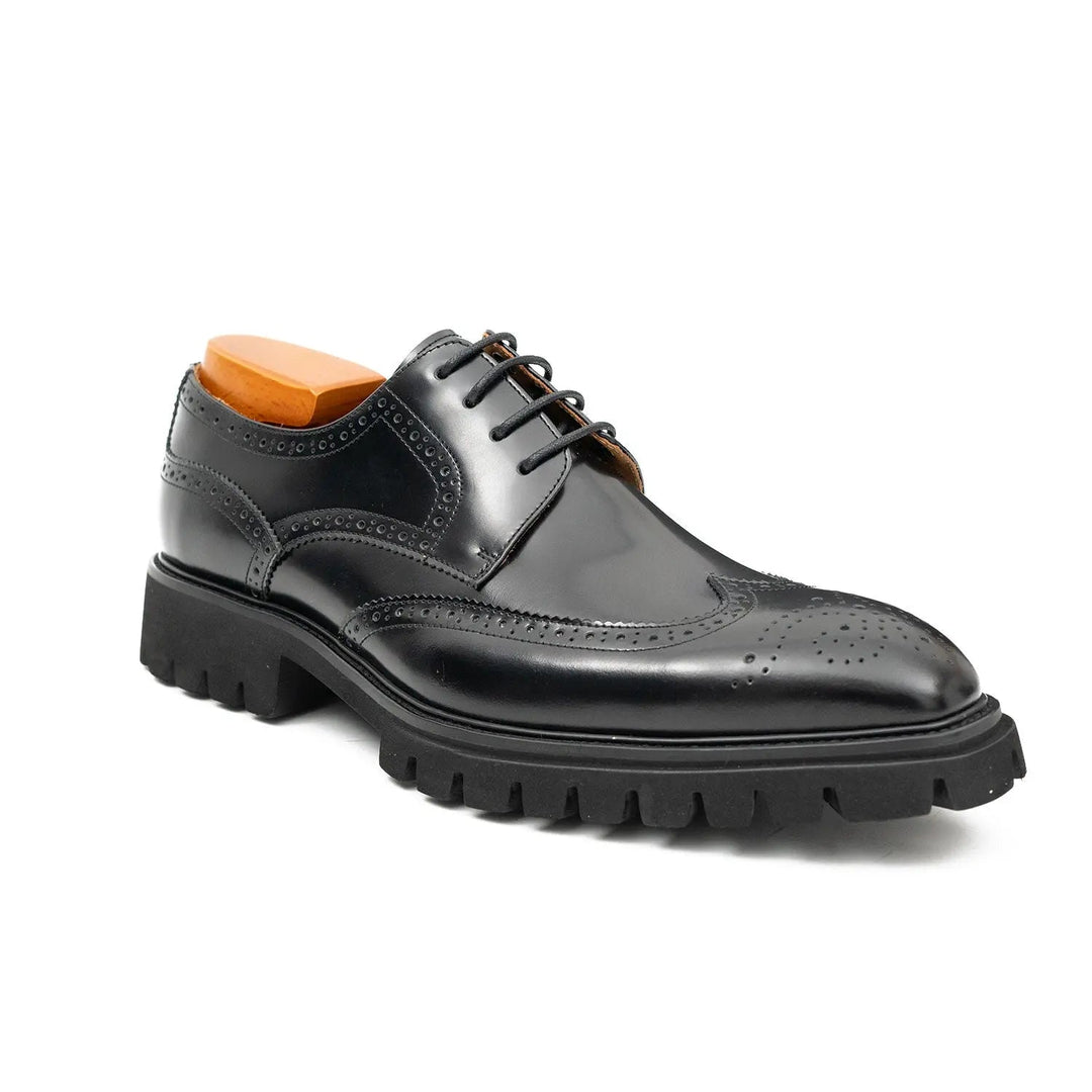 Black derby brogue dress shoes with lace-up front, perforated toe, platform-style sole