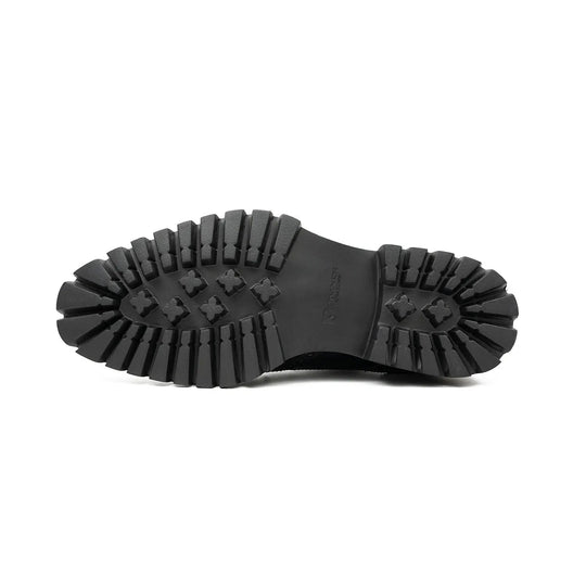 Black derby brogue shoe outsole with star-pattern tread and textured sidewall