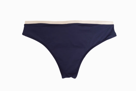 Midnight blue swim brief with wide beige waistband