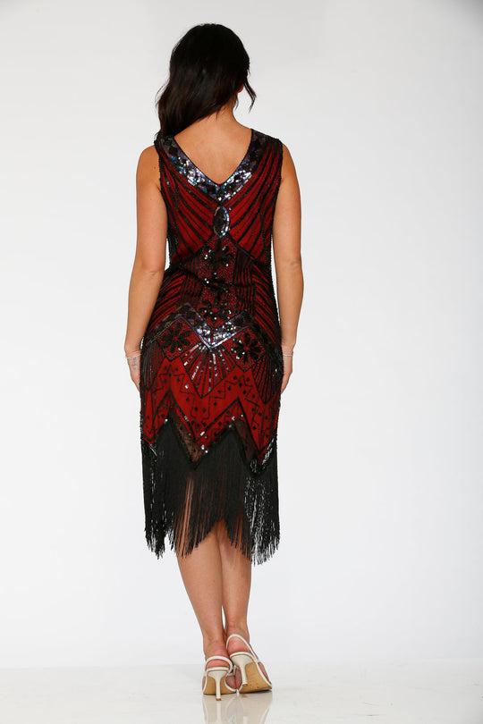 Back view black and red flapper dress showing draped beading and long fringe hem