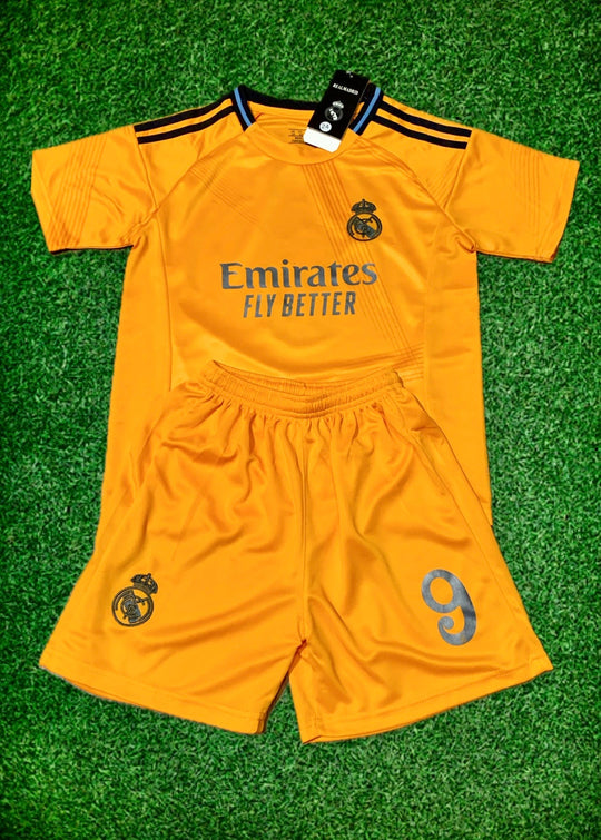 Orange jersey and shorts with Emirates Fly Better logo and blue number 9