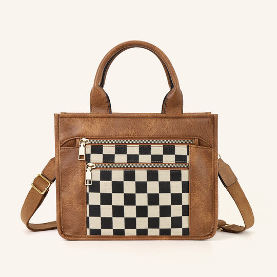 Jordan Mixed Media Tote with checkered black-and-white panel, cognac handles, strap