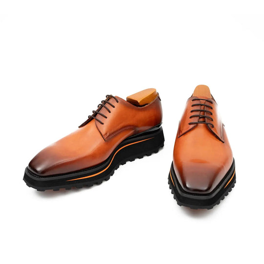 Brown derby shoes with lace-up front and chunky tread sole