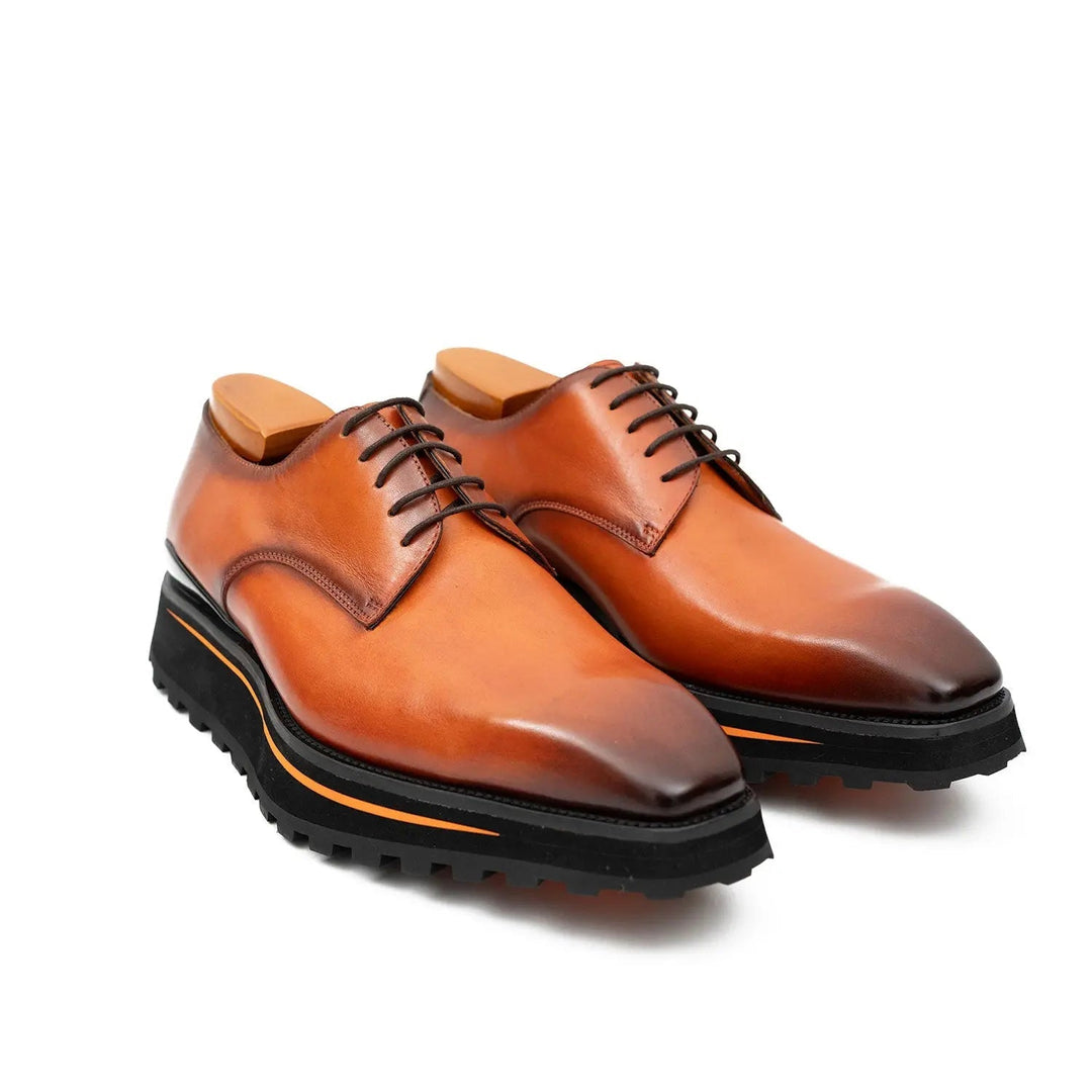 Brown lace-up business derby shoes, angled side view with black tread outsole