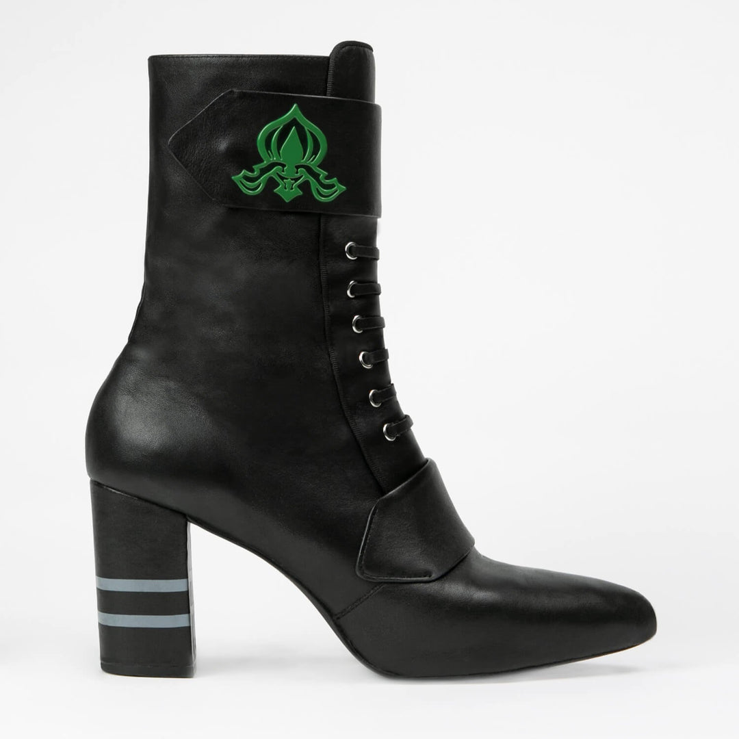 Black ankle boots side view with block heel and green emblem patch