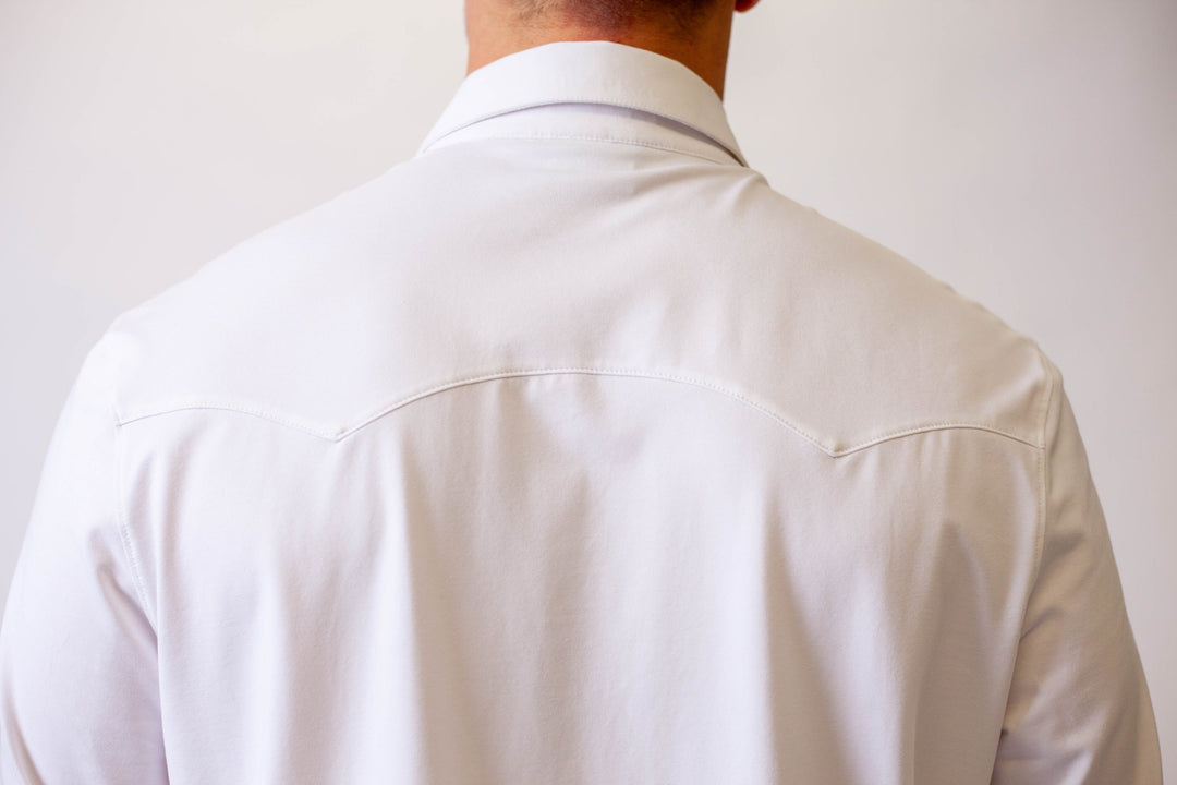 Back of white Western tech shirt with yoke seam detail