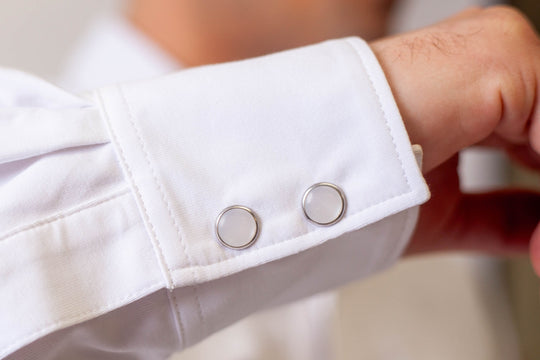 White Western tech shirt cuff with two snap-style buttons