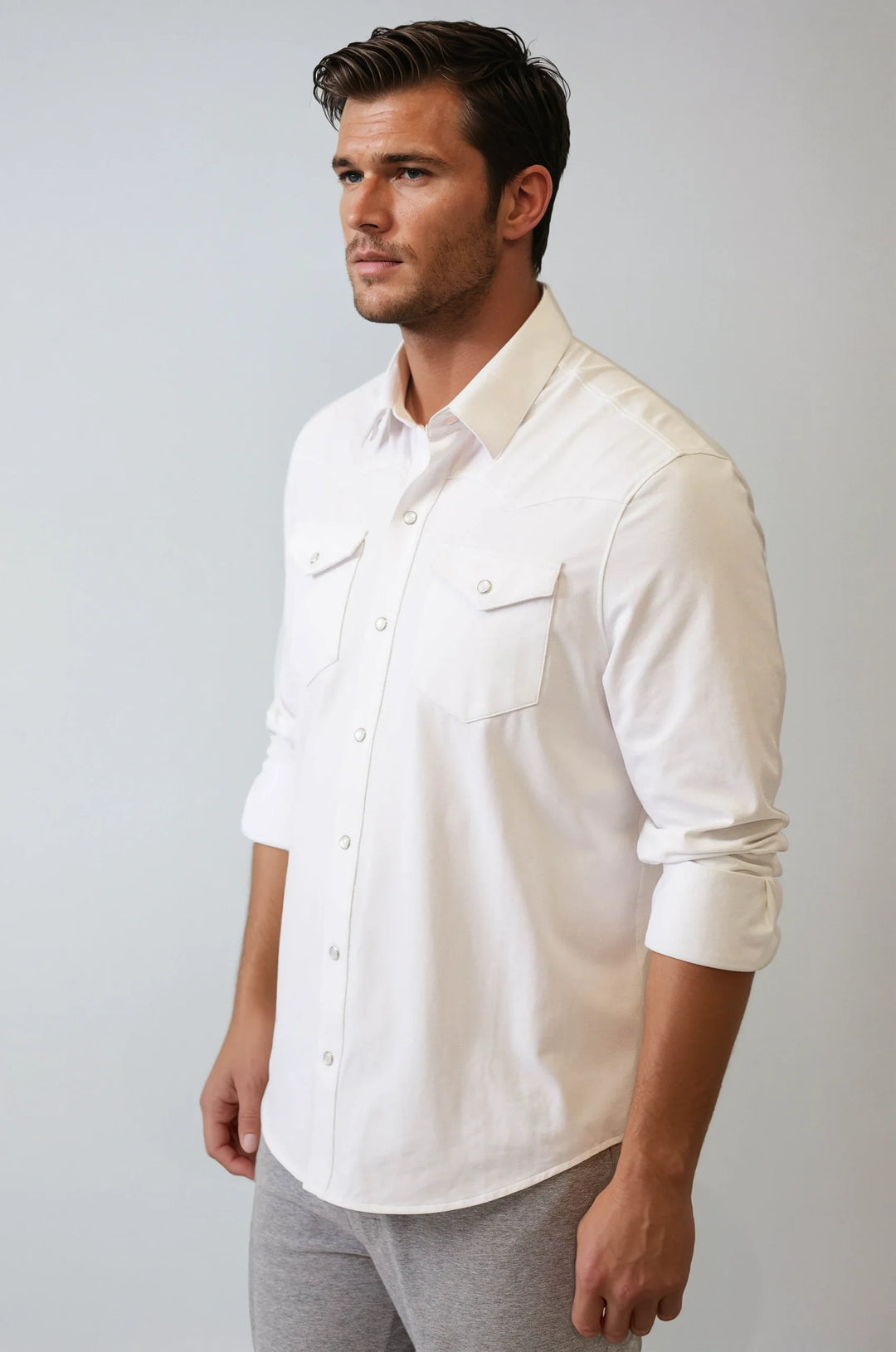 White Western tech shirt, three-quarter view with chest pockets and button placket
