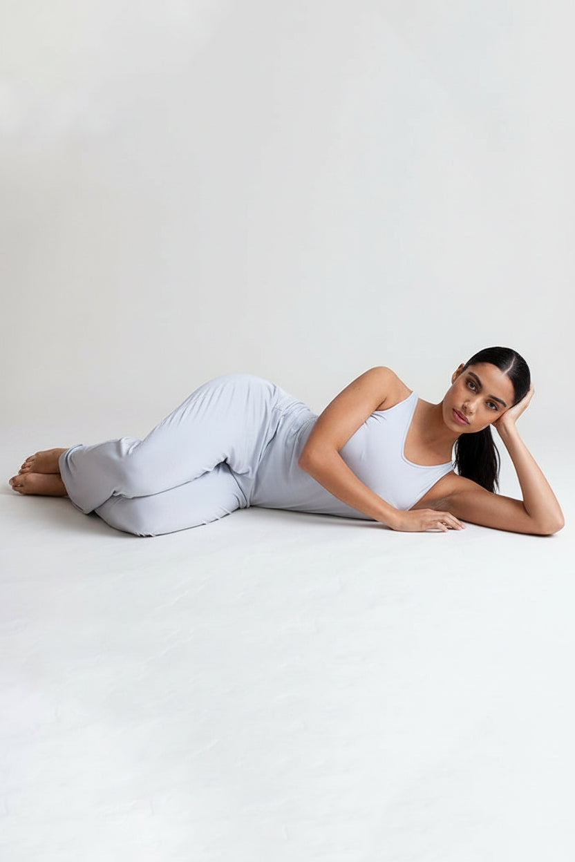 Pearl Grey lounge pants shown lying down, elastic waist and straight relaxed legs.