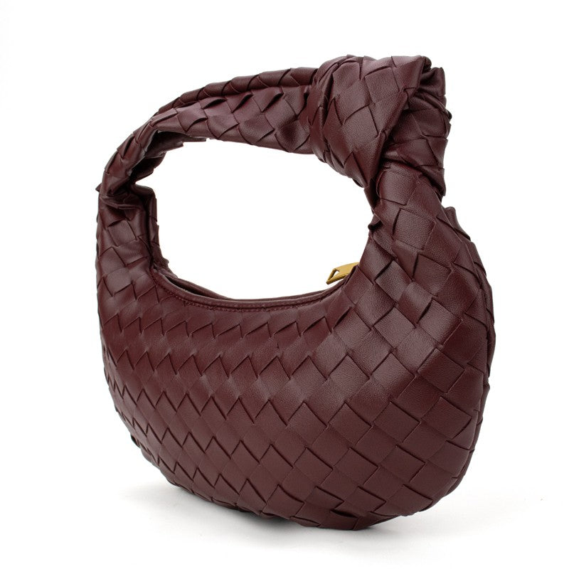 Knotted woven handbag in cranberry, knotted woven handle, woven texture
