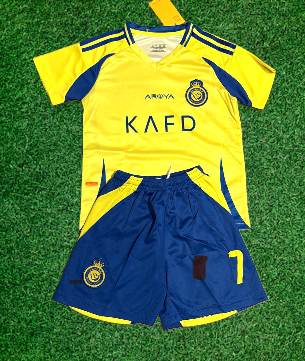 Yellow front soccer jersey with KA FD print and blue shorts, youth kit