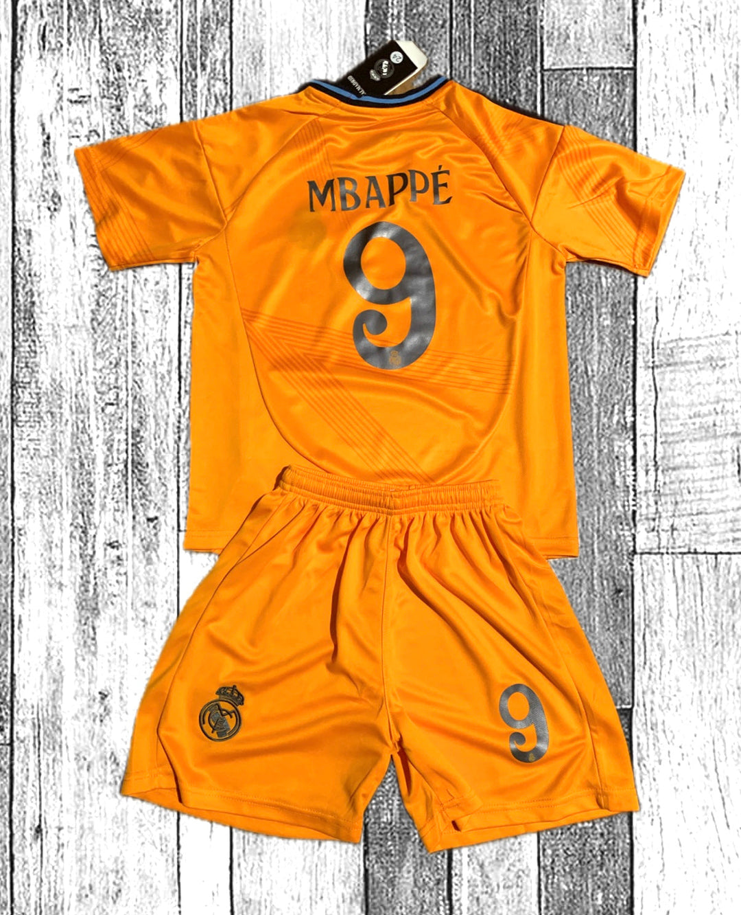 Orange MBAPPE 9 soccer jersey and shorts set with Real Madrid crest details