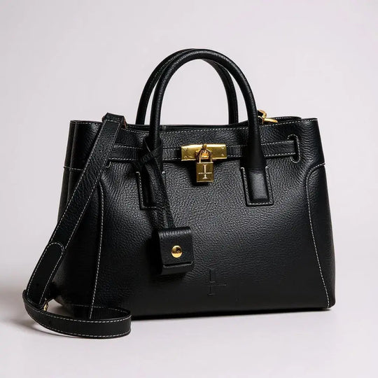 THE SHARON CLAUDIA bolso negro de cuero con correa, asa doble y placa con candado dorado