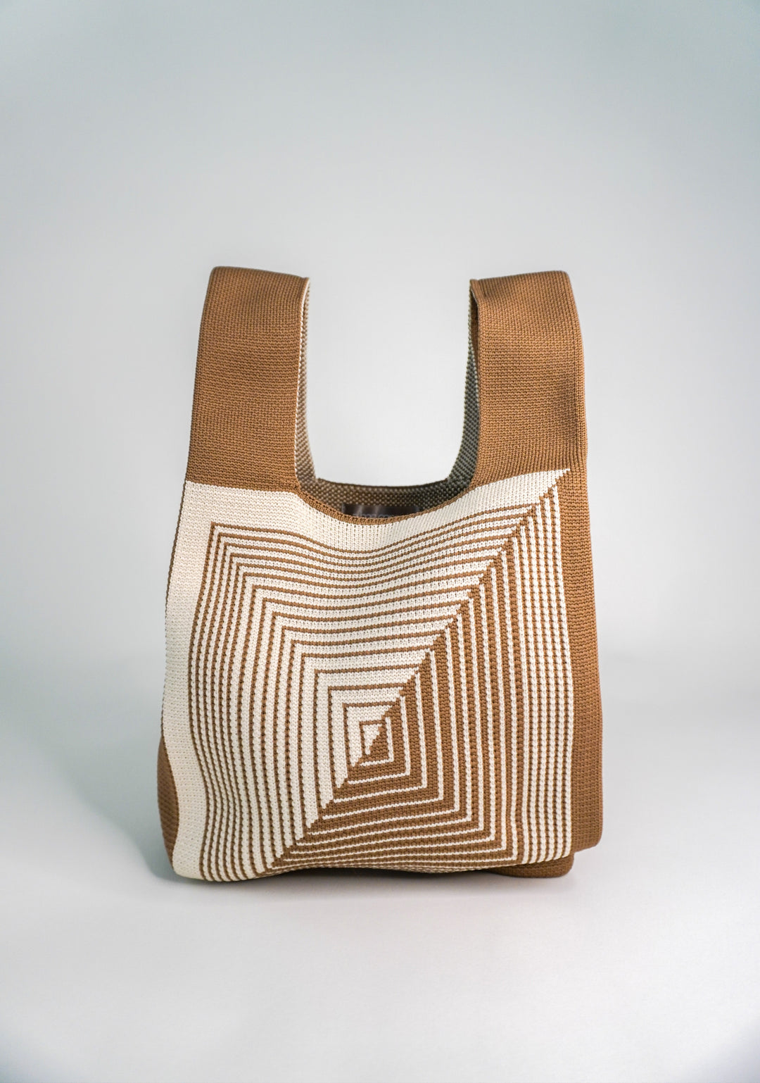 Beige/cream hobo handbag with open top and labyrinth stitch design