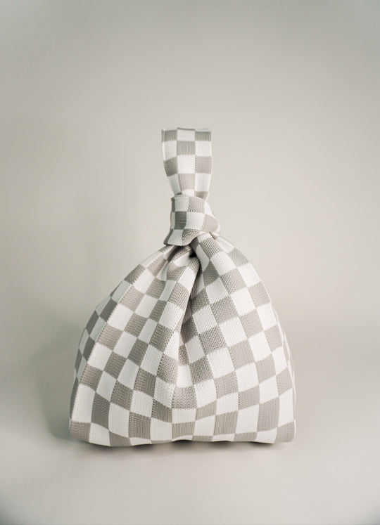 Classic checkered grey handbag with drawstring top and knot handle