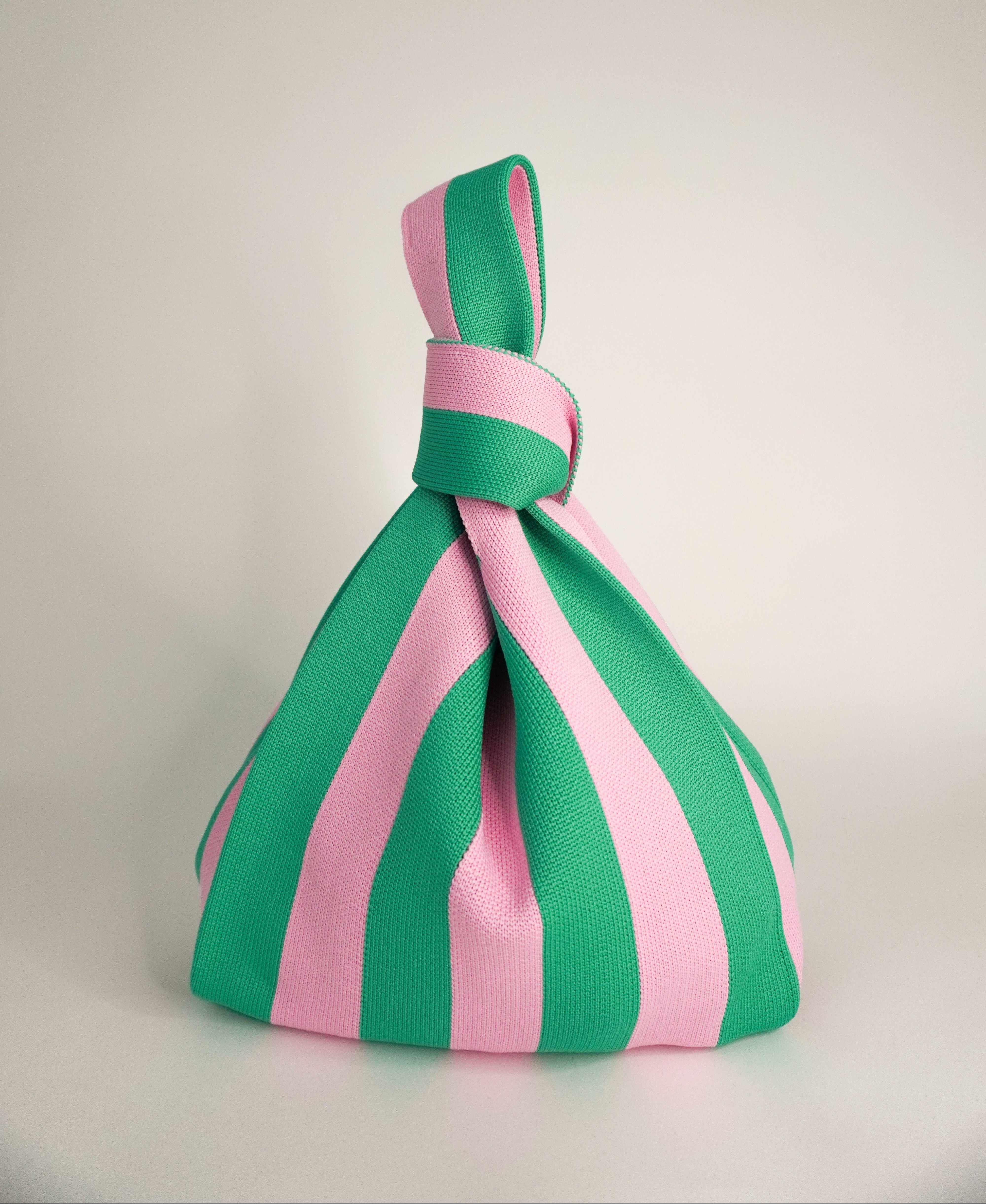 Green and pink striped handbag with top bow handle