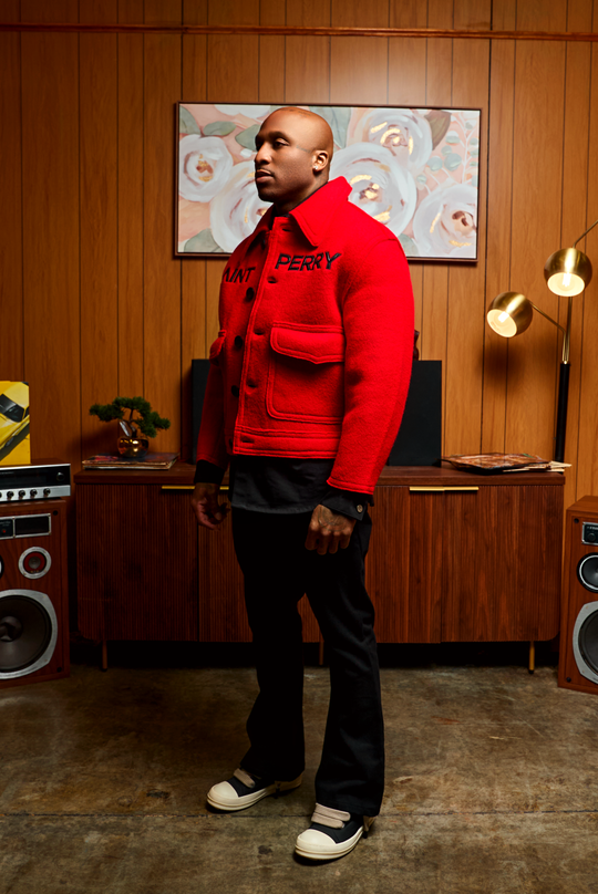 Red boxy jacket side profile with button front and chest flap pockets