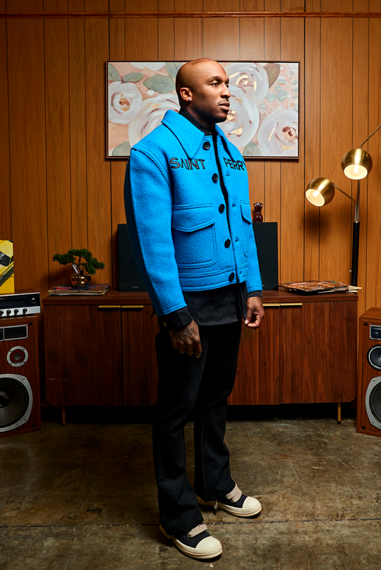 The Blue Love Boxy Jacket, profile view: chest pockets and dark button placket