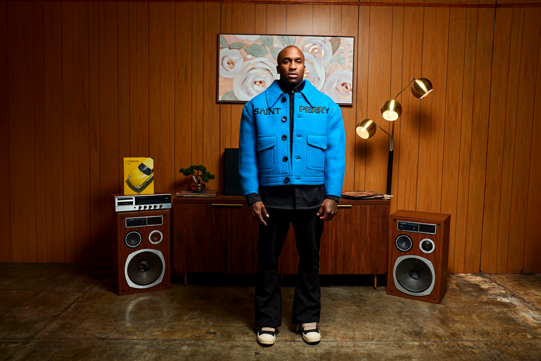 The Blue Love Boxy Jacket front: buttoned placket, two flap chest pockets, logo