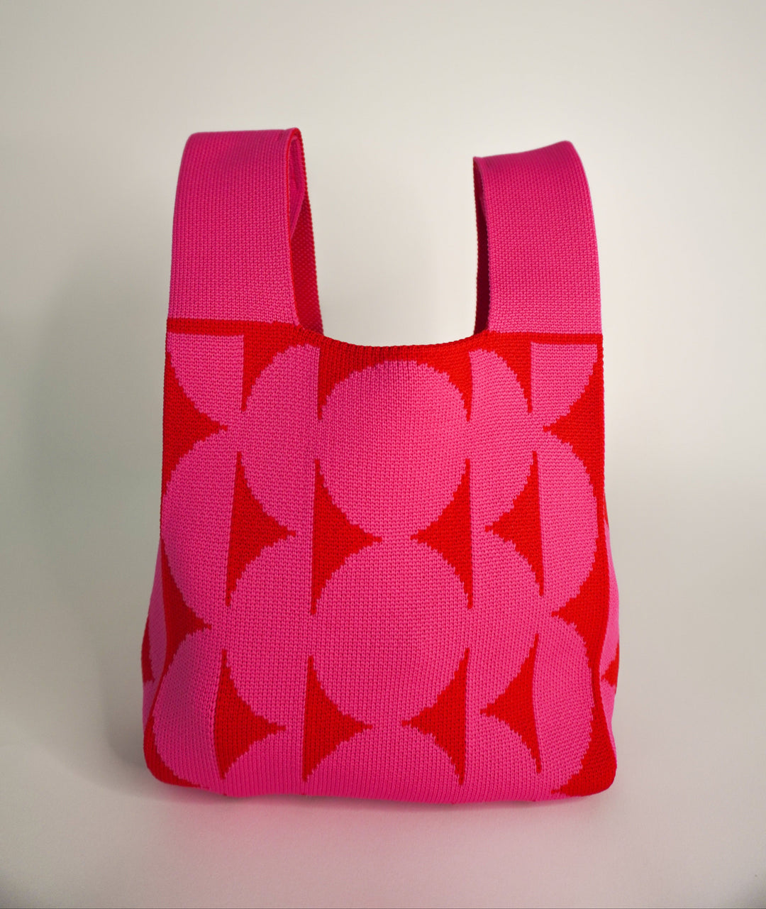 Pink Portobello tote-style bag with open top and floral leaf print