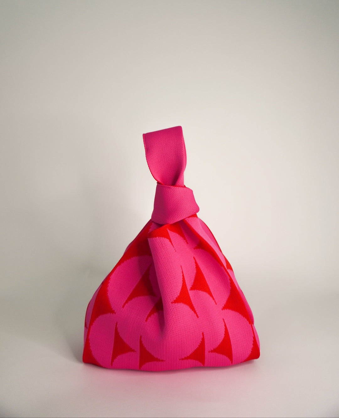 Pink Portobello drawstring handbag, bold floral leaf print