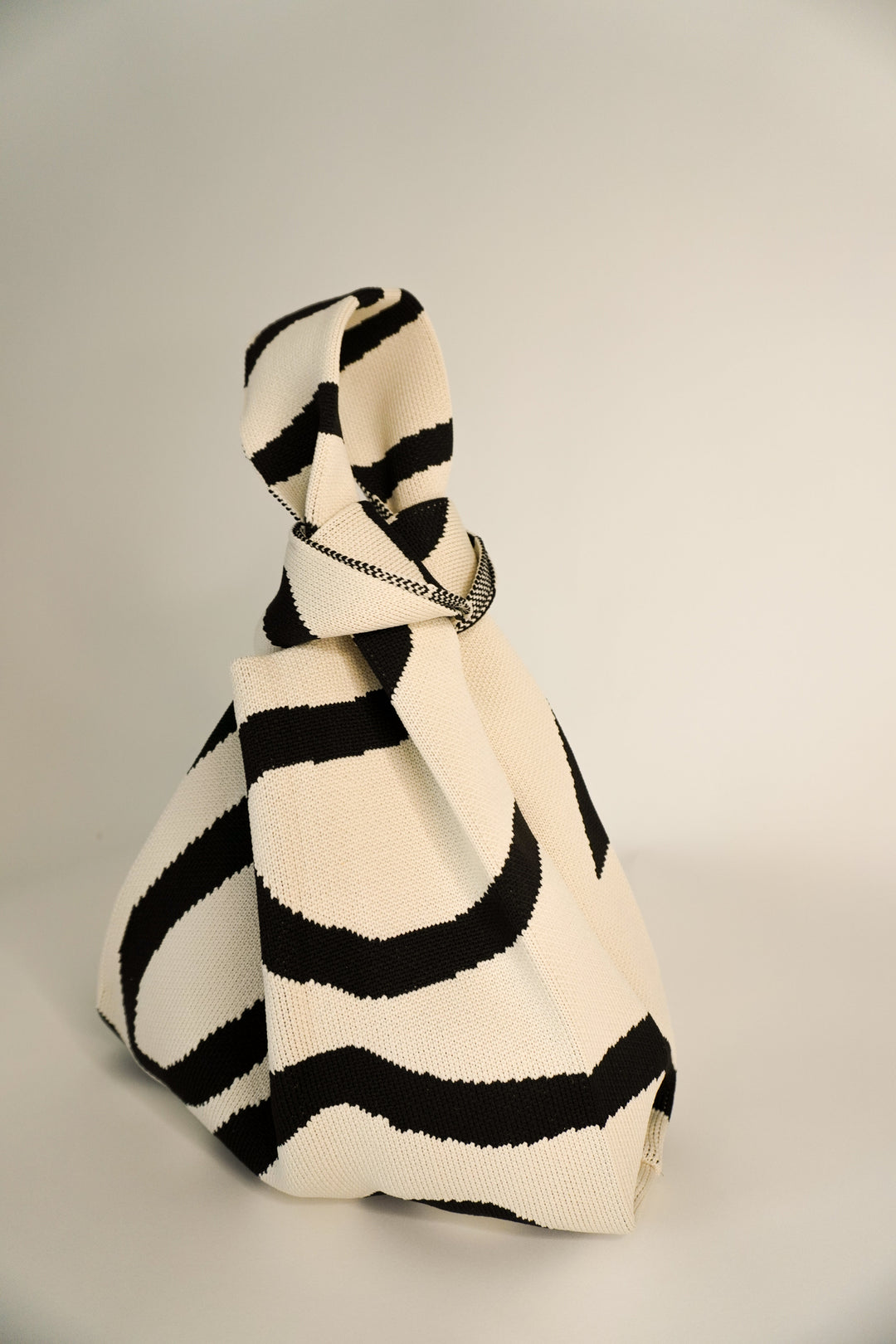 Meander Black tote-style handbag with black-and-cream wave stripe fabric