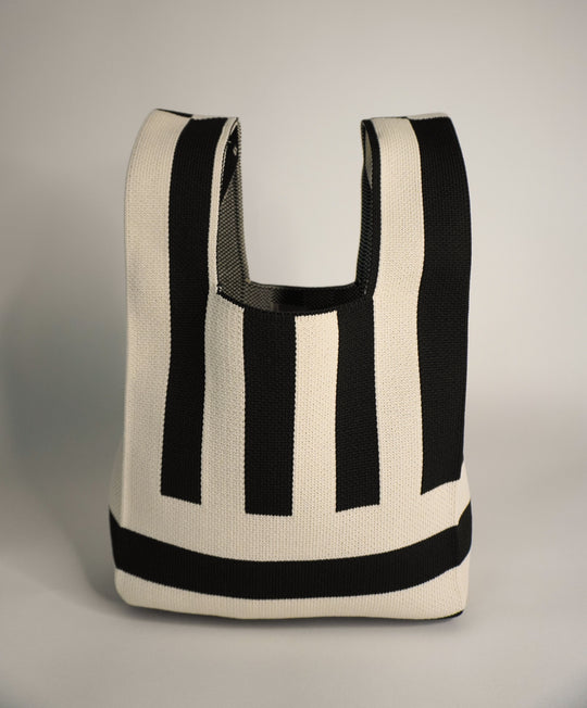 The Original² handbag with U-shaped handle opening and bold black-and-cream stripes