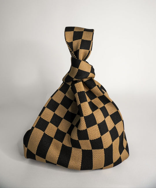 Classic checkered brown handbag with drawstring-style gathered top