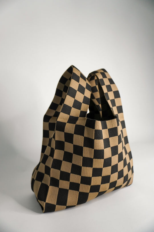 Checkered brown handbag with structured rounded bottom