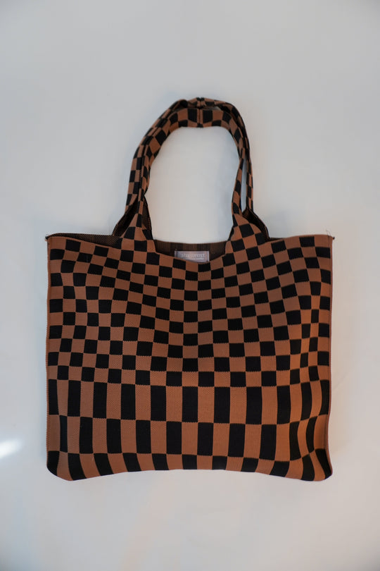 Classic checkered skinny tote bag with brown-and-black checkerboard pattern and top handles.