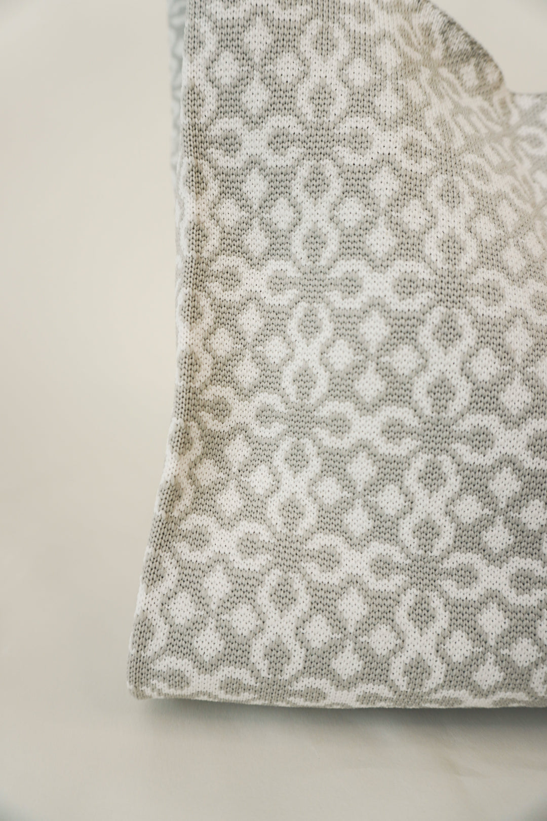 Grey Solitaire Handbag fabric close-up with repeating geometric motif.