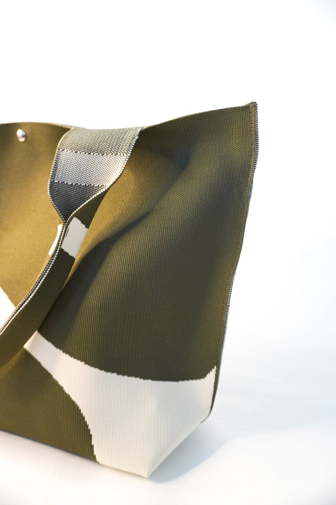 MOOdy Green Signature Tote back corner, soft structured shape, green canvas with white pattern
