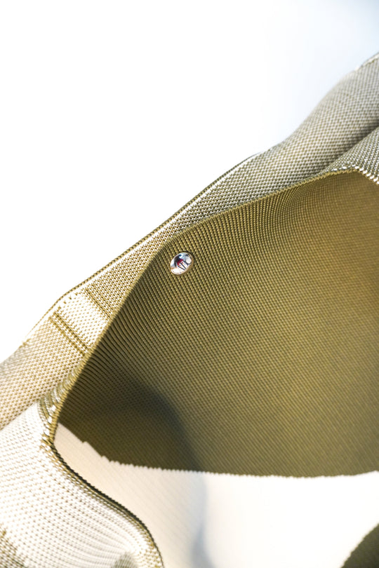 MOOdy Green Signature Tote metal snap button detail on green-and-white strap trim