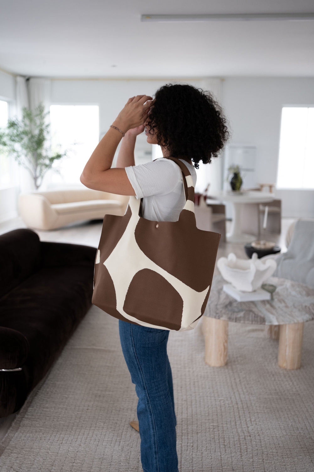 Brown and cream graphic tote bag with short handles and snap-top closure