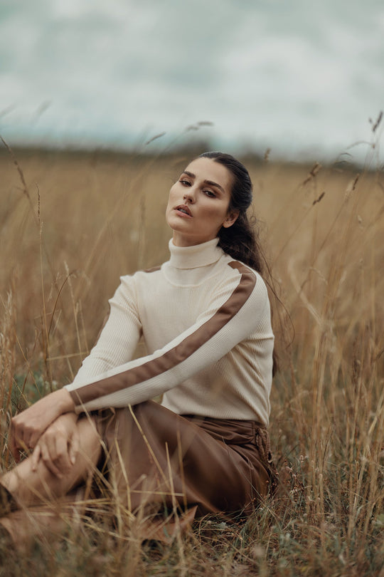 Ivory turtleneck sweater with cognac leather trim