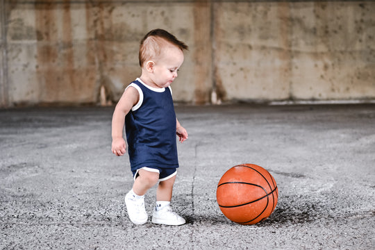Navy bamboo rib track shorts set with white trim, toddler outfit view