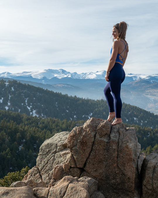 Revolution Crop in Blue, open-back crisscross straps and supportive sports bra fit