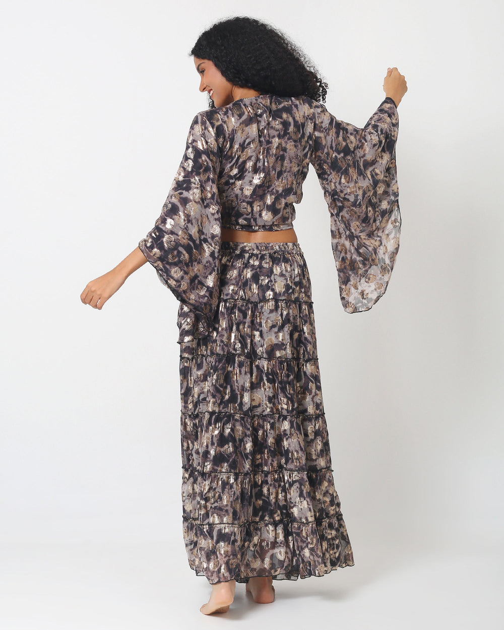 Dubai skirt set back view: tiered maxi skirt with elastic waist and flared sleeve top